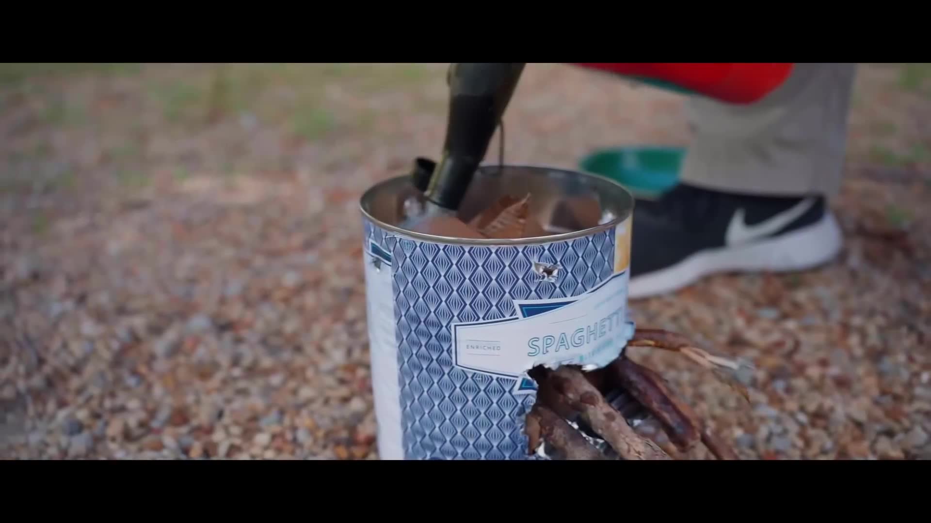 Ex-CIA officer creates improvised cooking device from discarded materials for emergency situations