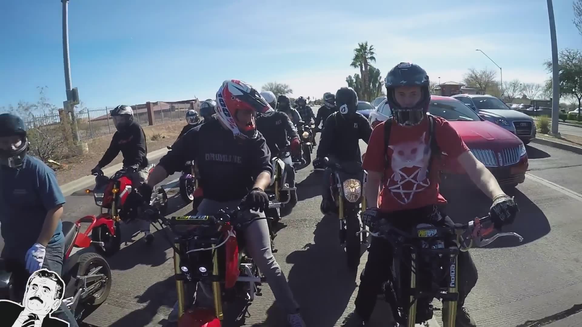 Miniature motorcycle rider falls during wheelie training session on compact bike