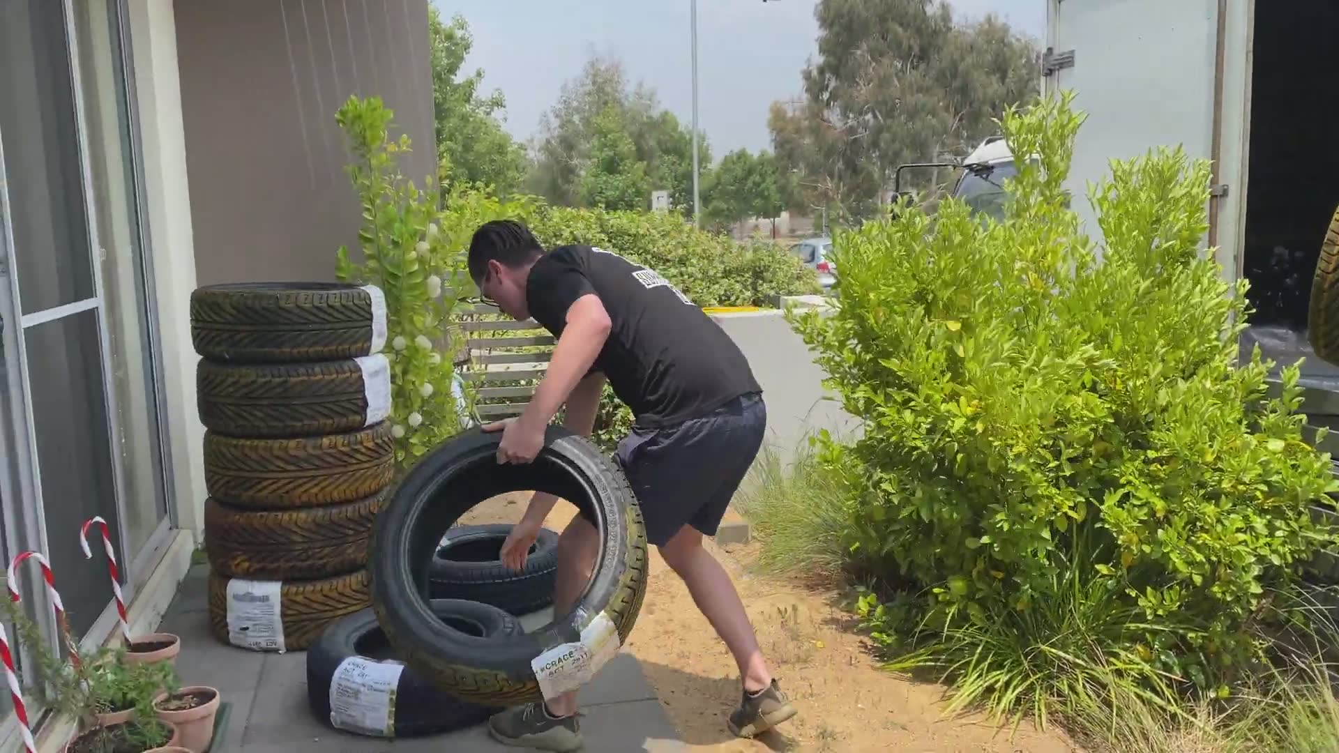 Preparing colored smoke tires for Australia's biggest burnout competition