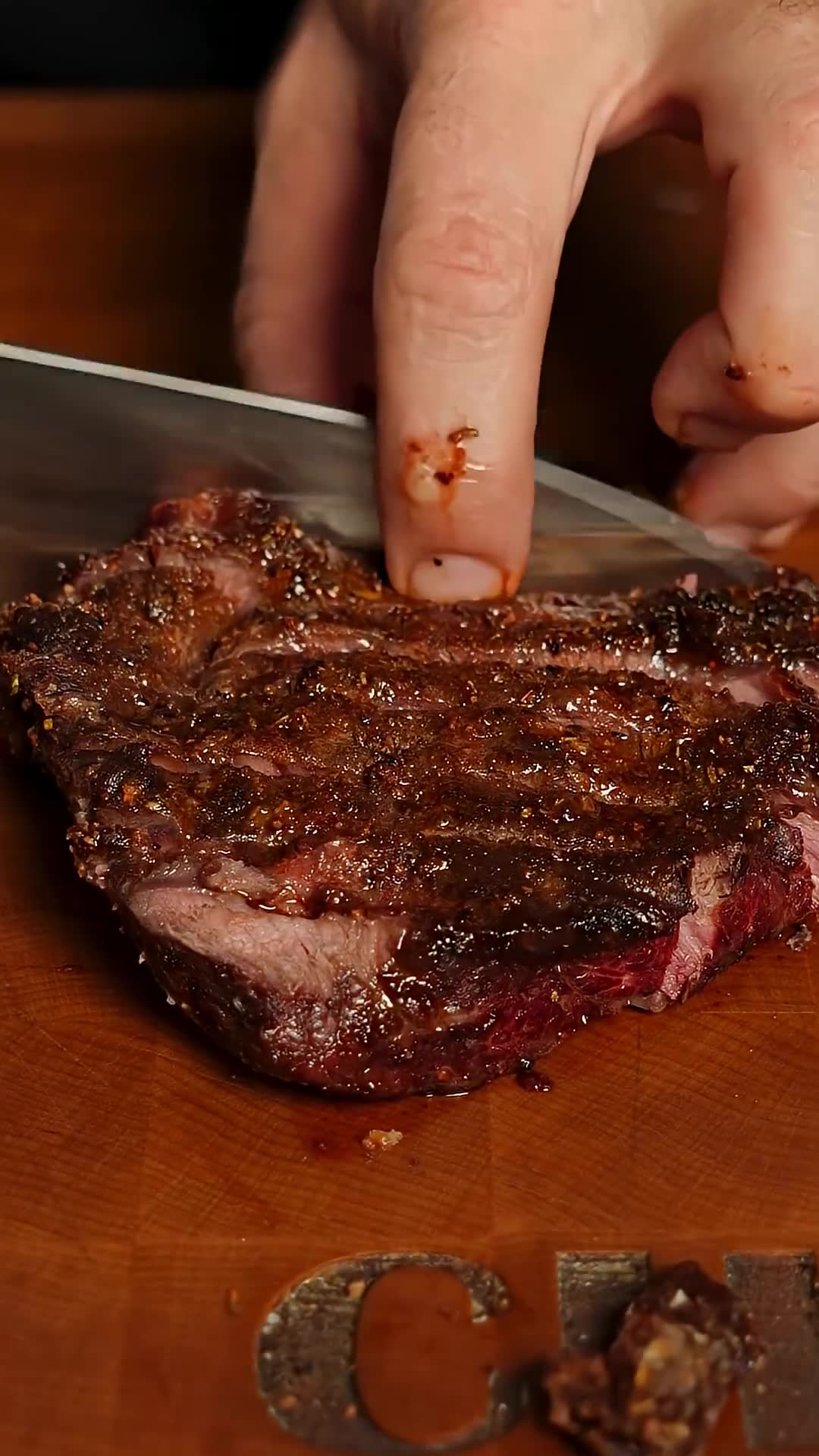 Grilled flank steak crostini appetizer on the charcoal grill