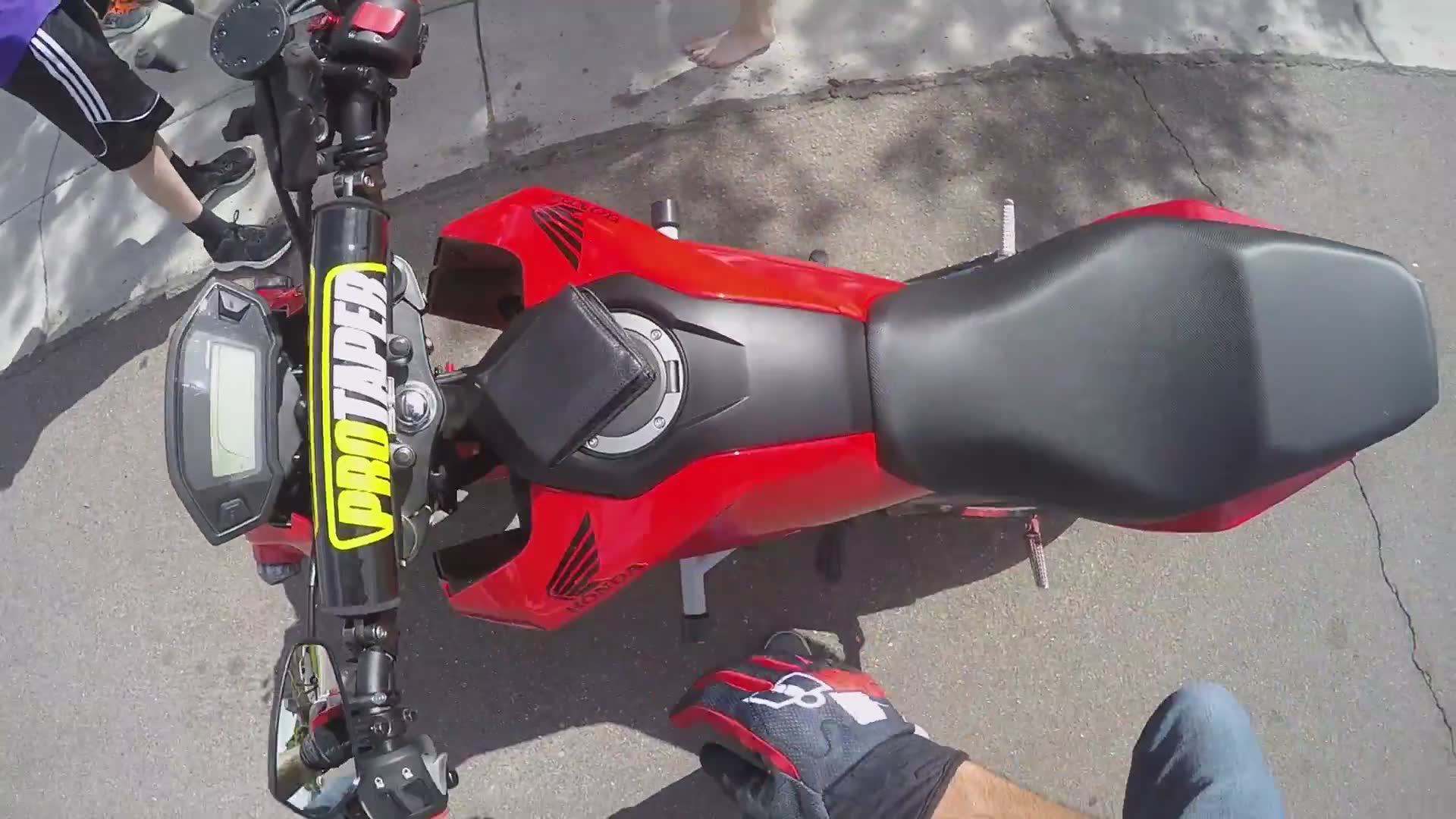 Motorcycle rider supports young business owners at neighborhood stand