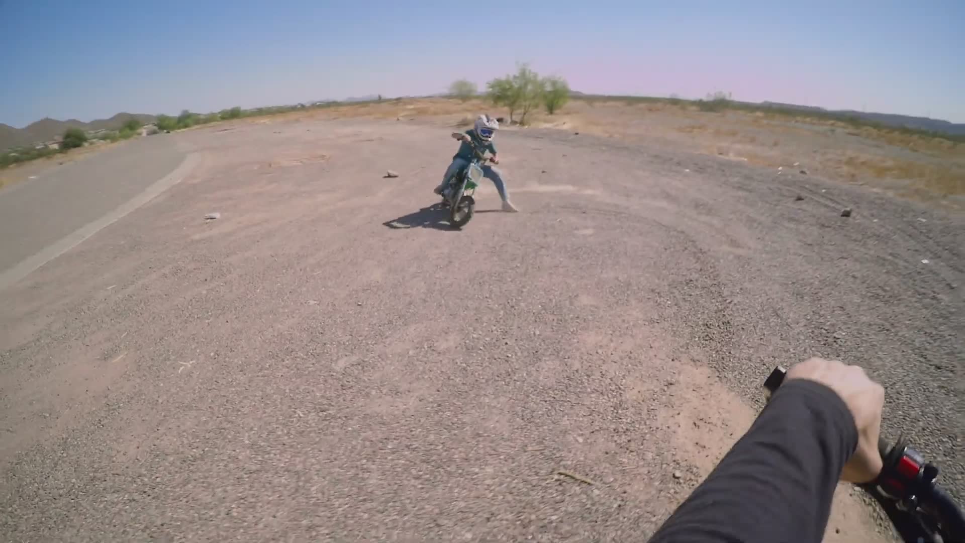 Miniature motorcycle drag racing between friends for bragging rights