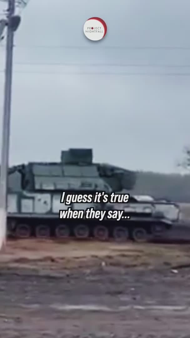Ukrainian civilians tow abandoned military vehicles with tractors