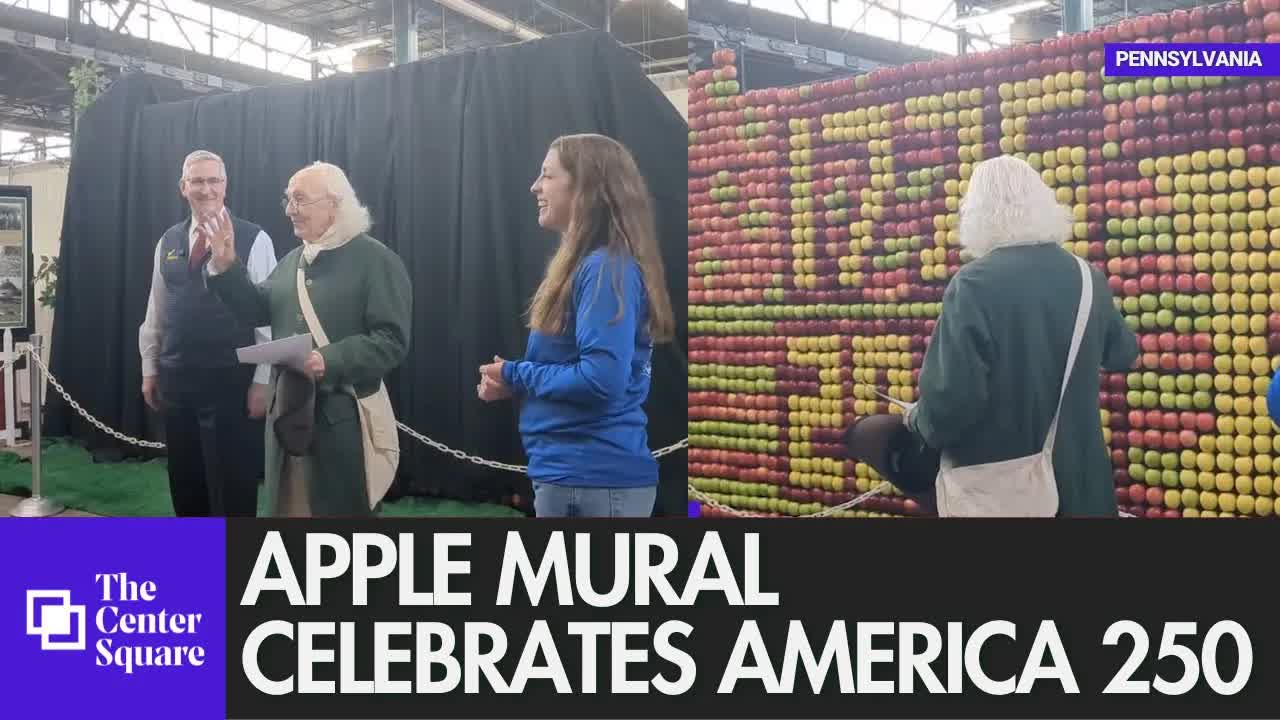 "Benjamin Franklin" reveals apple mural commemorating America's 250th birthday