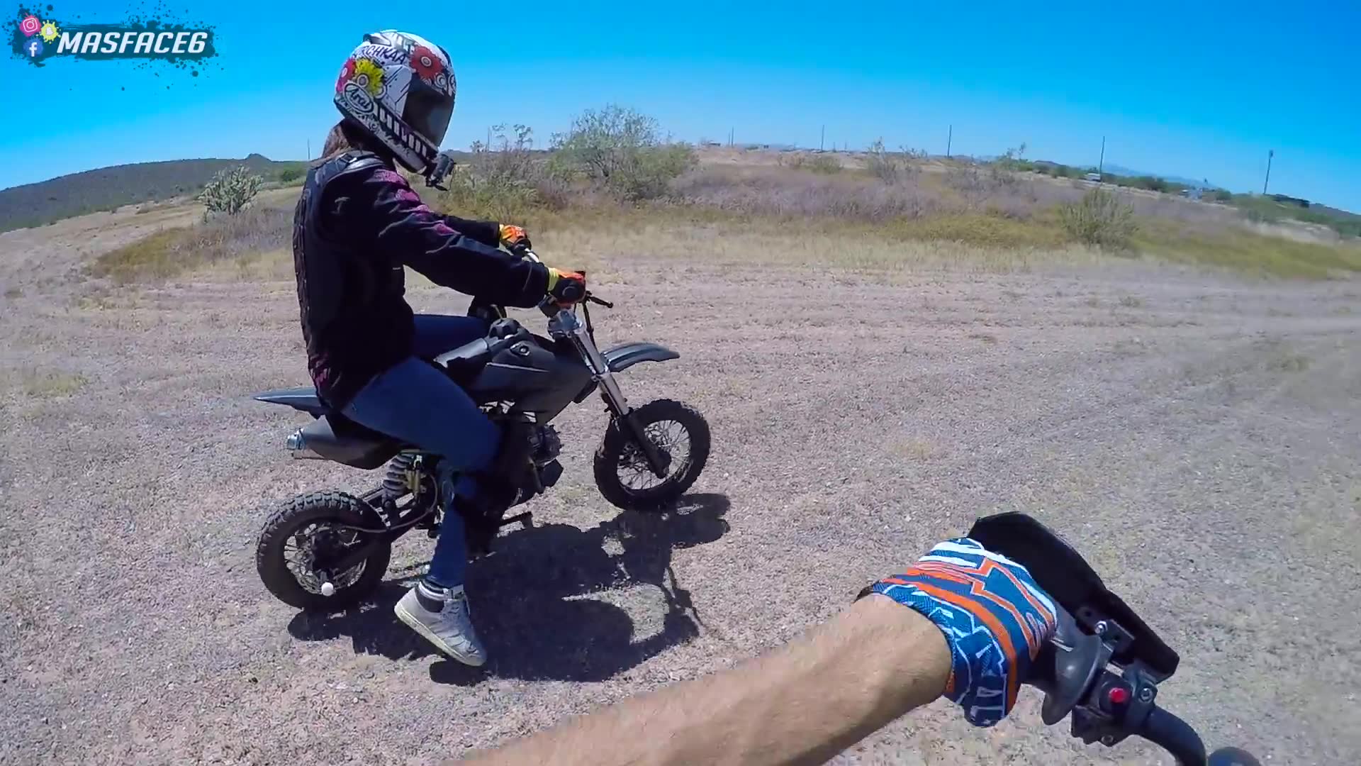 Couple enjoys mini motorcycle fun on pit bikes in neighborhood