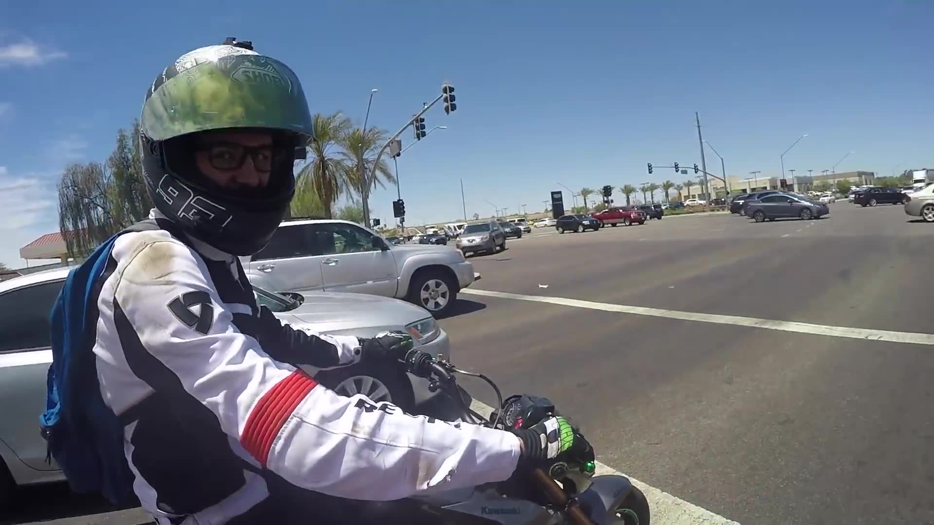 Diesel truck driver intentionally covers Honda Grom riders in black exhaust
