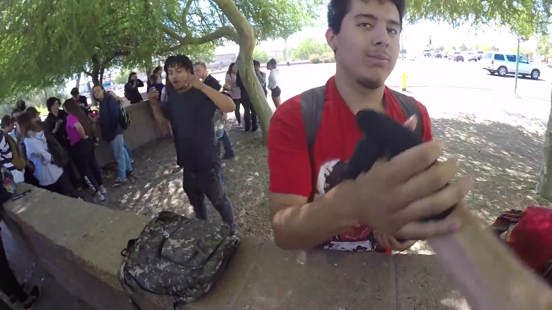 Giving away money to surprised high school students at random