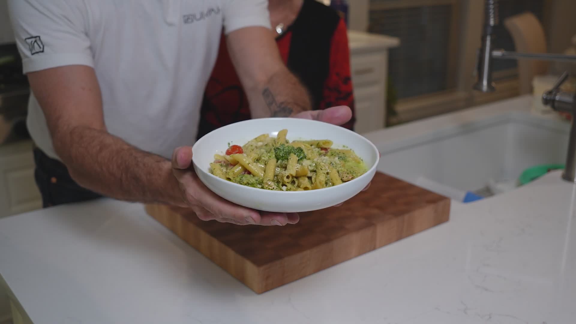 Cooking easy chicken pesto pasta together with family