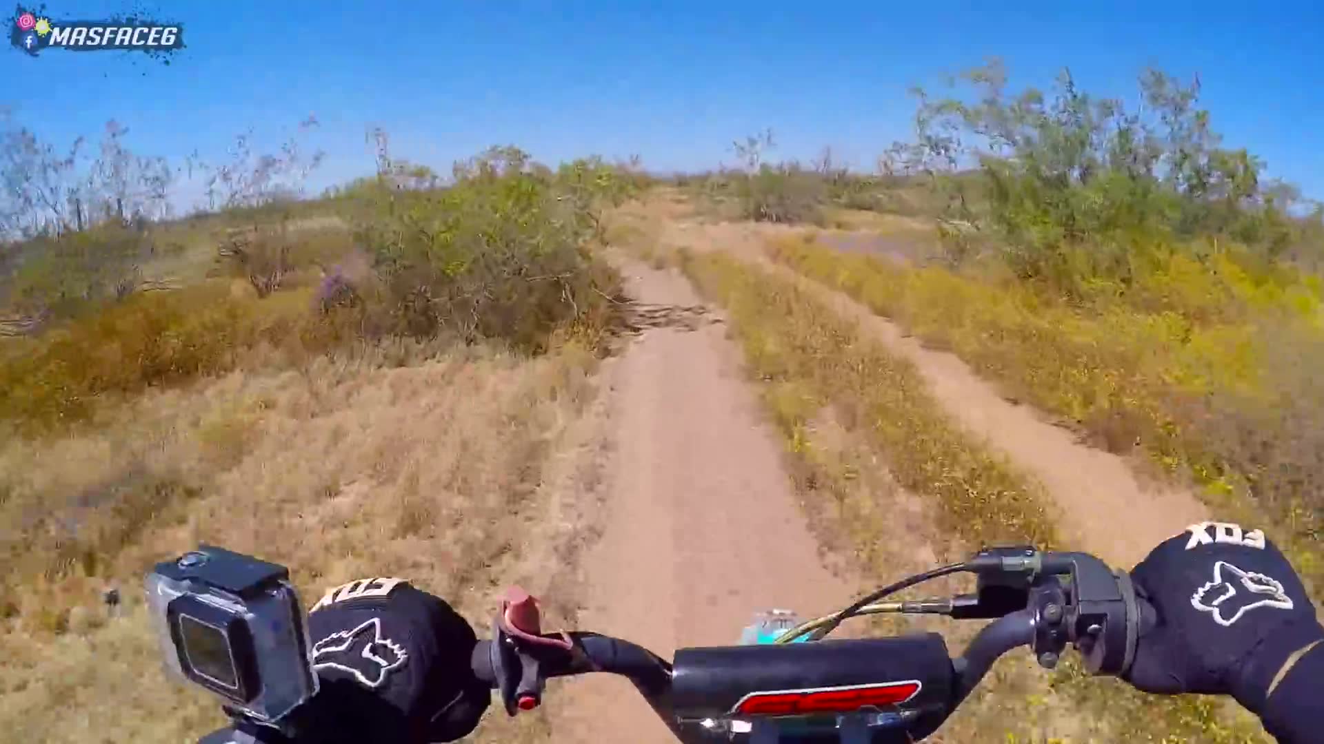 Sending the mini dirt bike over jumps and through the track at maximum speed