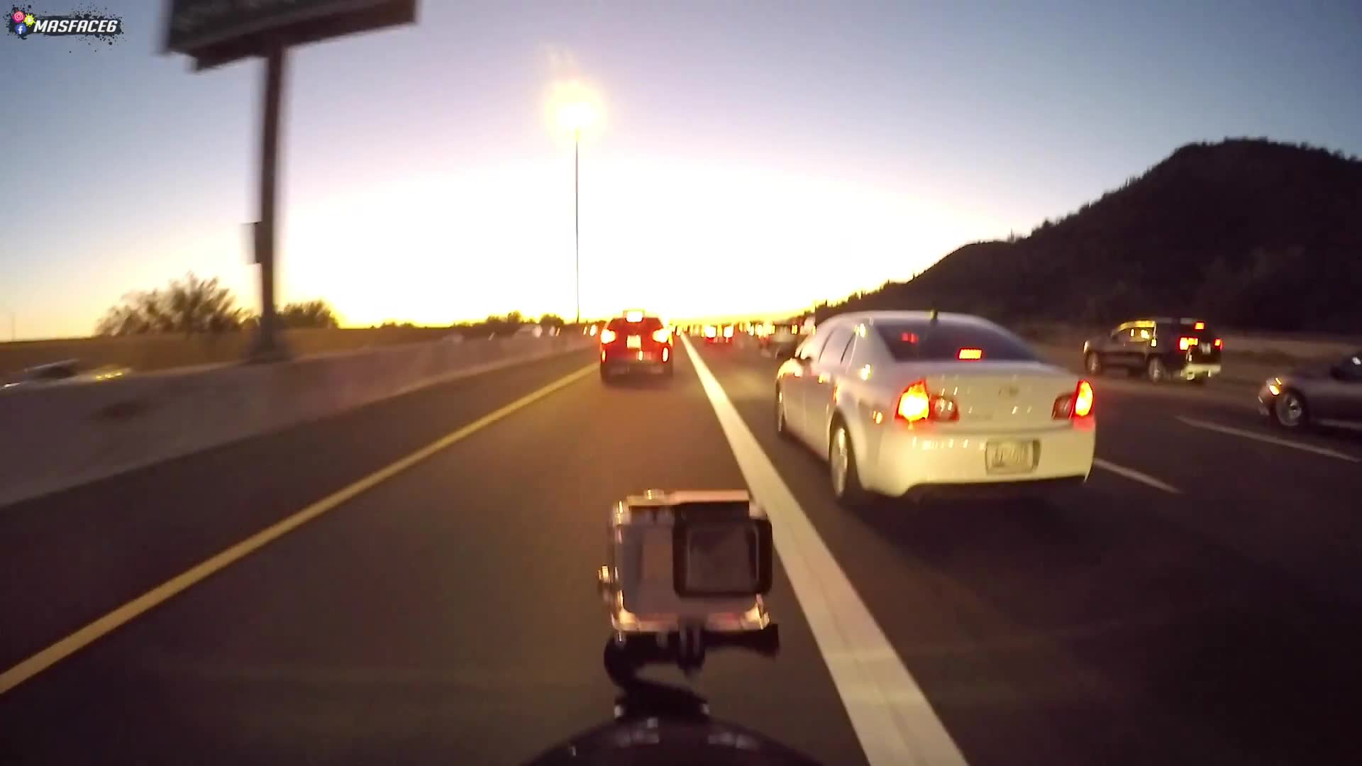 Navigating through bumper-to-bumper traffic on a motorcycle and dealing with chaos