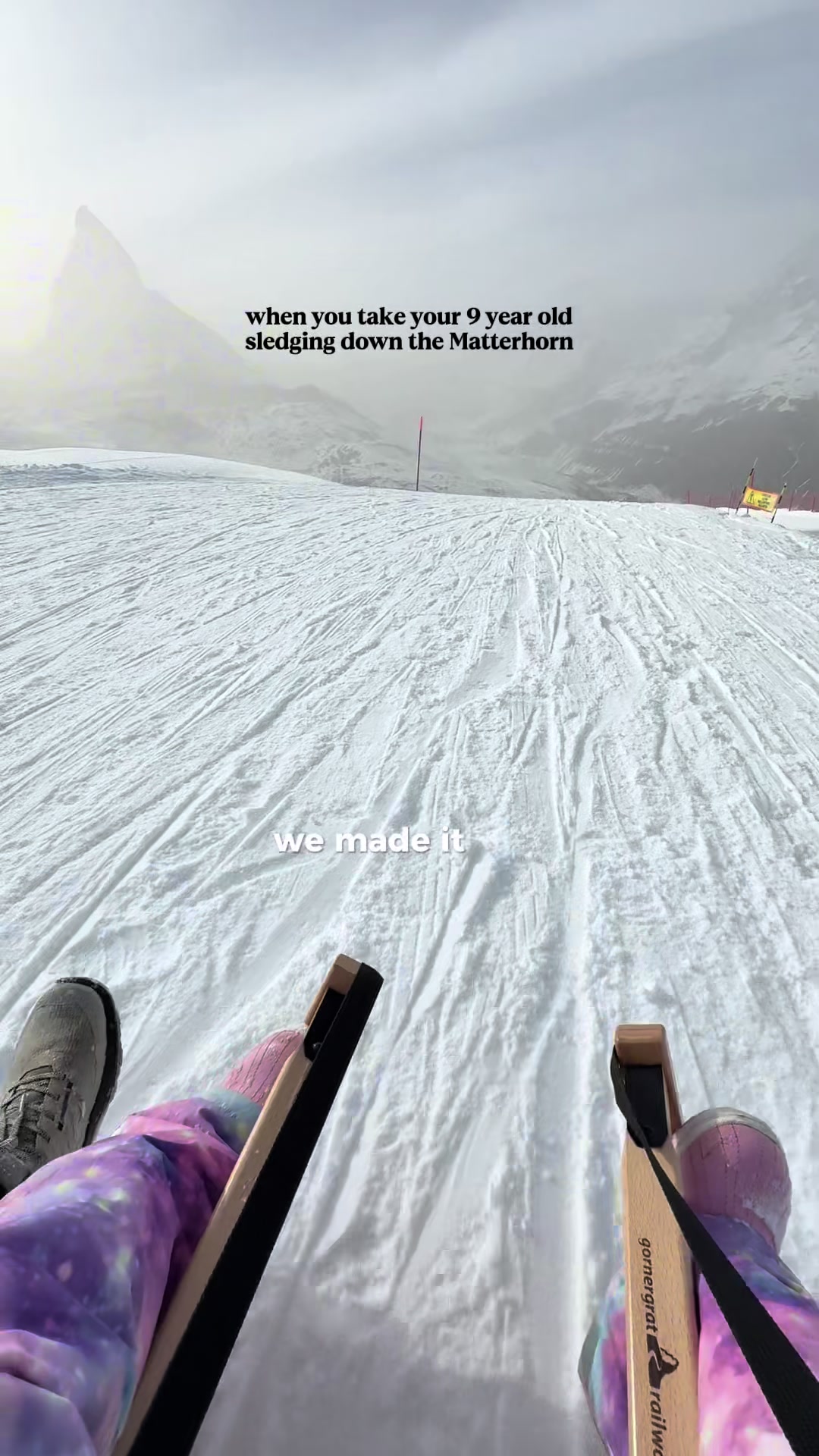 Mountain sledding adventure at Swiss Alps resort with young child