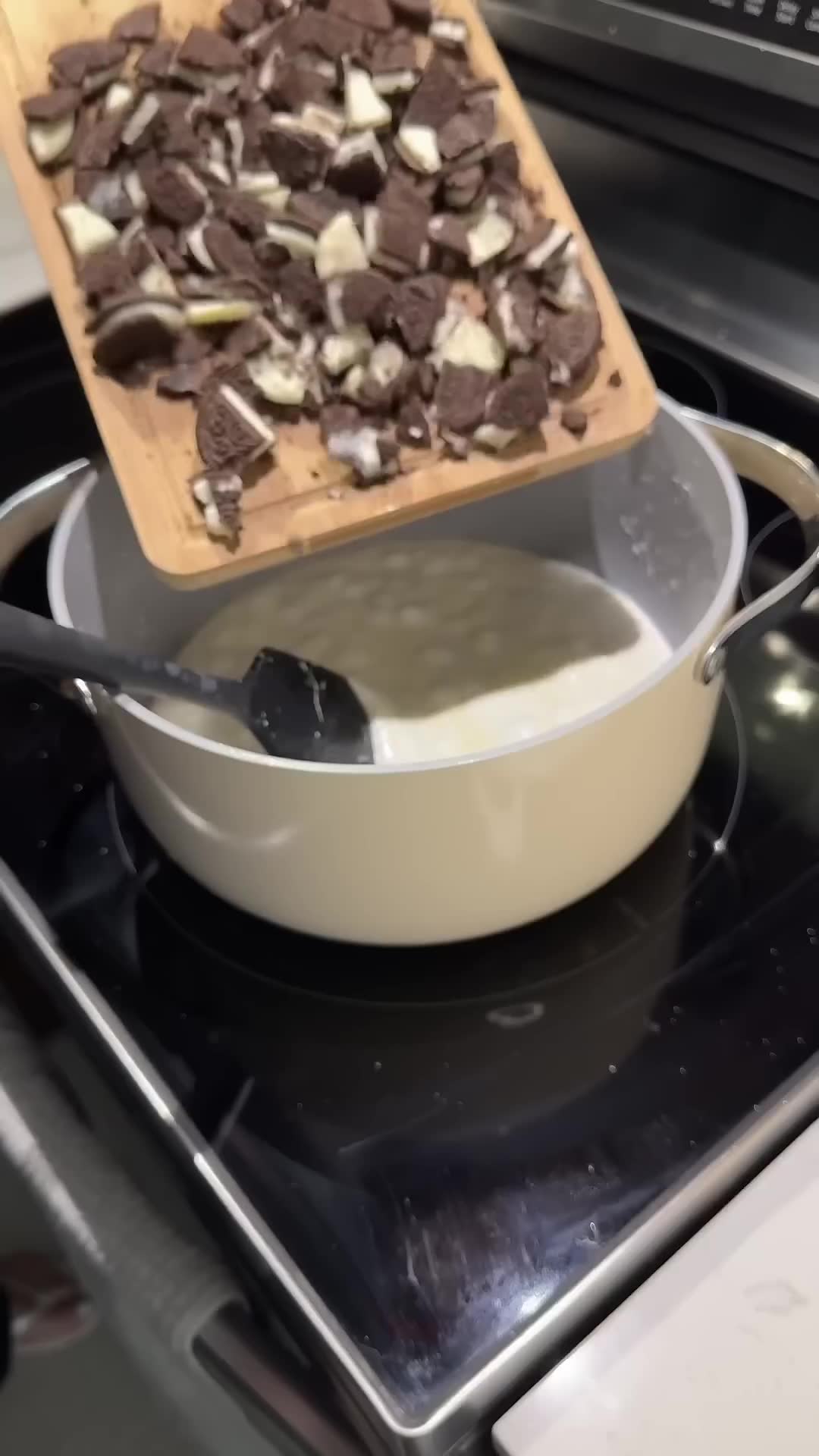 Popcorn coated in marshmallow with cookie pieces creates sweet snack