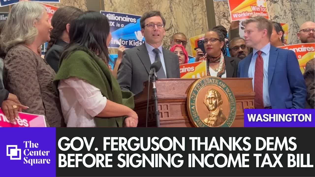 Gov. Bob Ferguson Thanks Members Of Washington Legislator Before Signing Income Tax Into Law