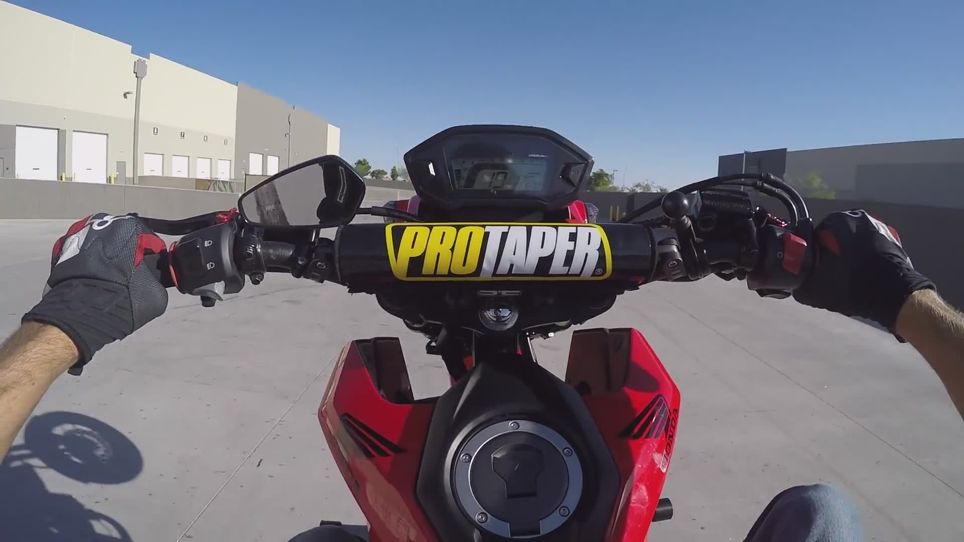 Honda Grom stunt attempt goes wrong resulting in hard pavement impact