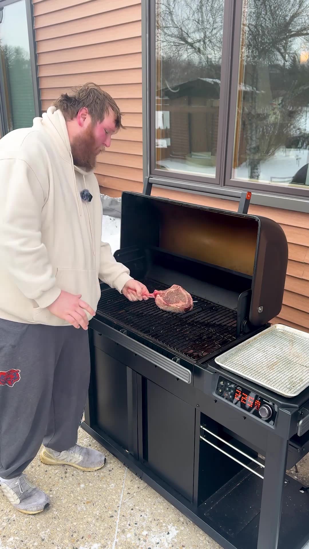 Outdoor tomahawk steak cooked perfectly despite freezing winter conditions