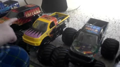 Monster truck toy freestyle competition with jumps, flips, and chaos