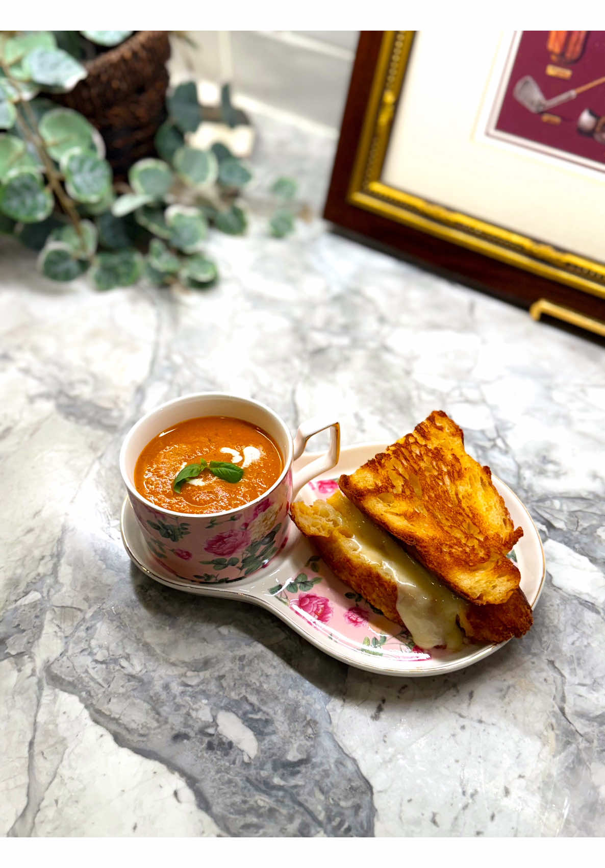 Warming tomato soup paired with golden grilled cheese sandwiches