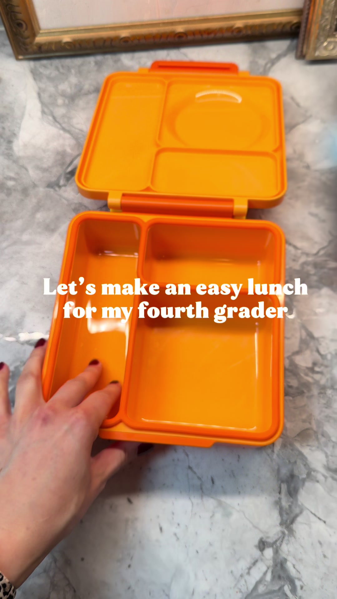 Monochrome lunch idea featuring orange fruits, vegetables, and treats