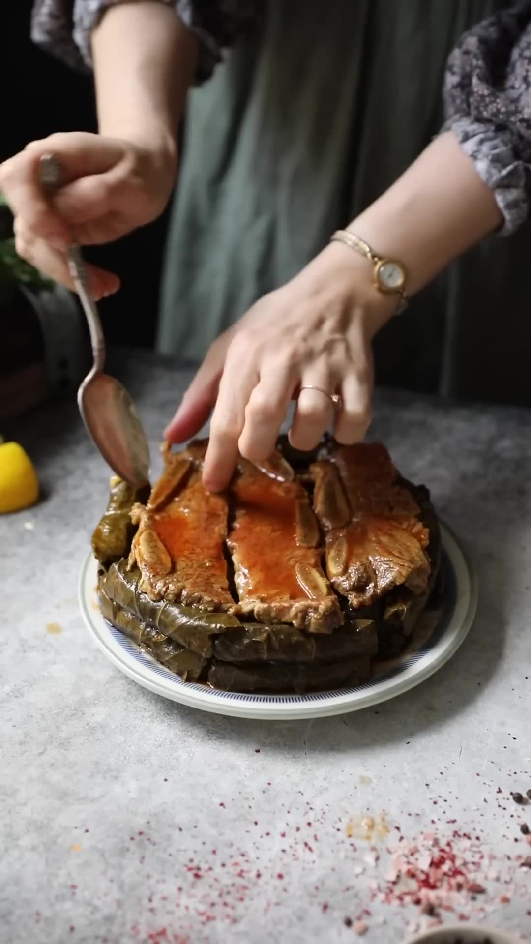 Marinated chicken preparation paired with wrapped grape leaves
