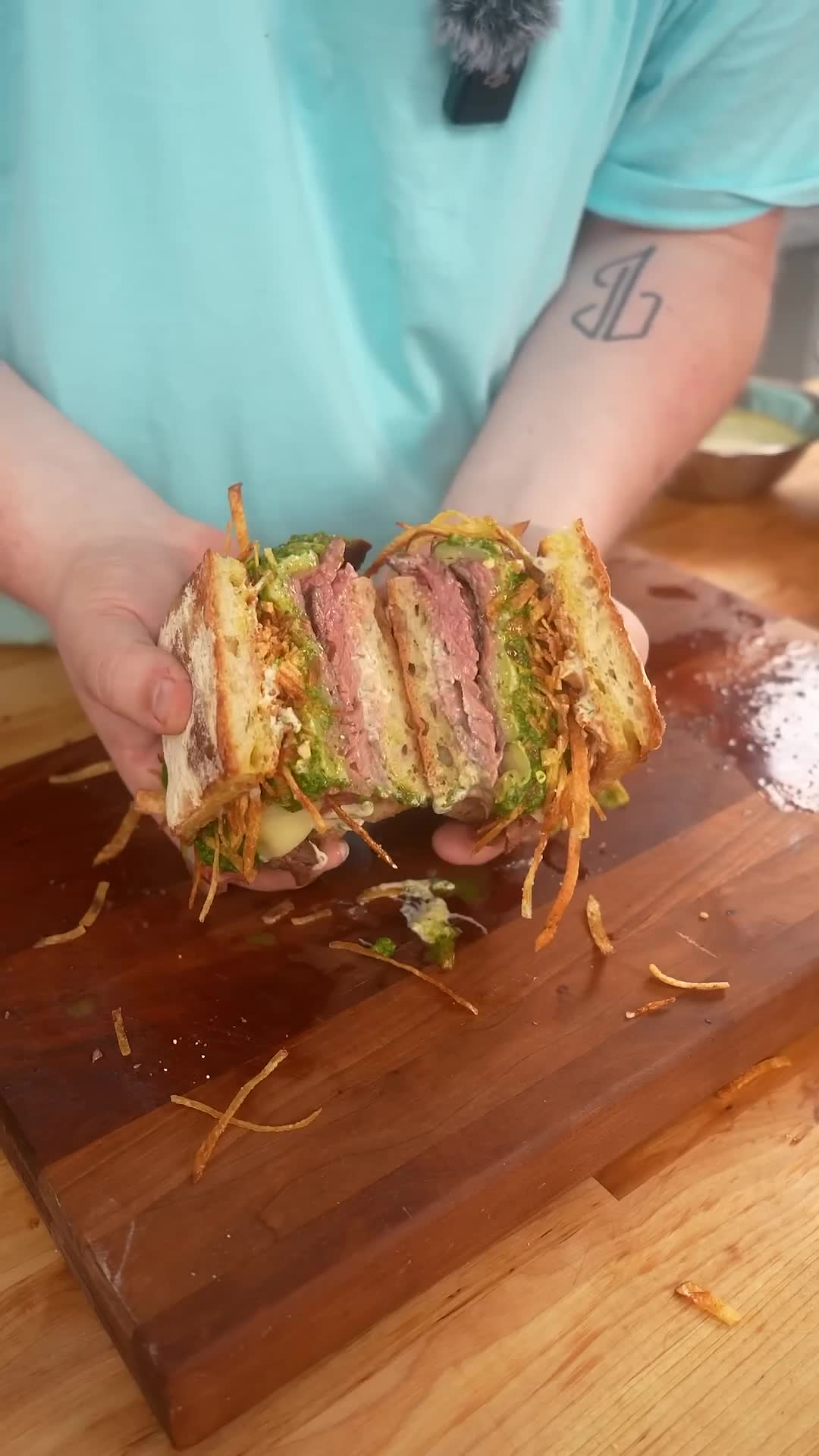 Steak sandwich with chimichurri sauce in friendly collaboration challenge
