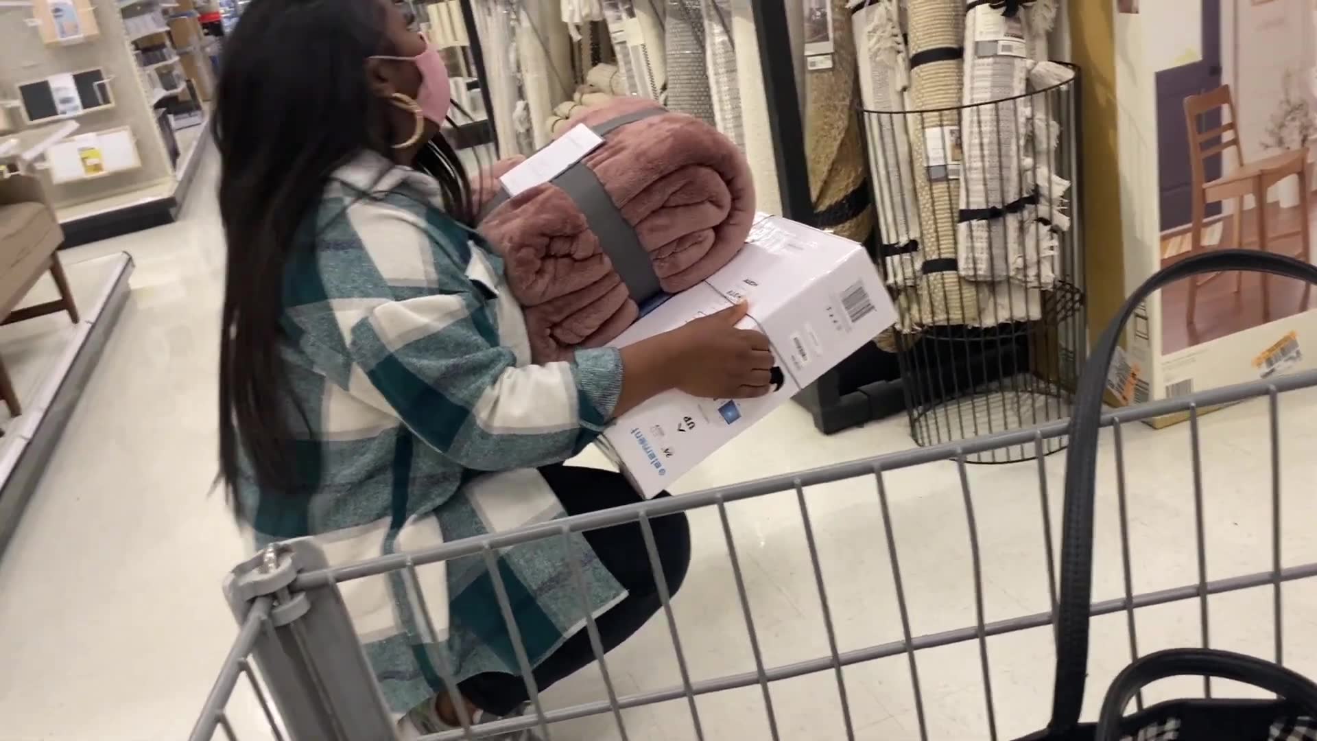 Girlfriend tries to maximize what she can carry for this buying challenge