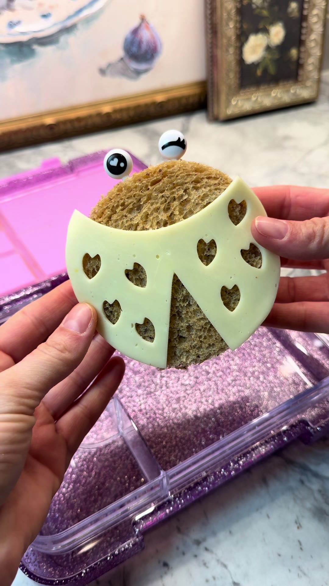 Love bug creation shaped sandwich with provolone heart decorations
