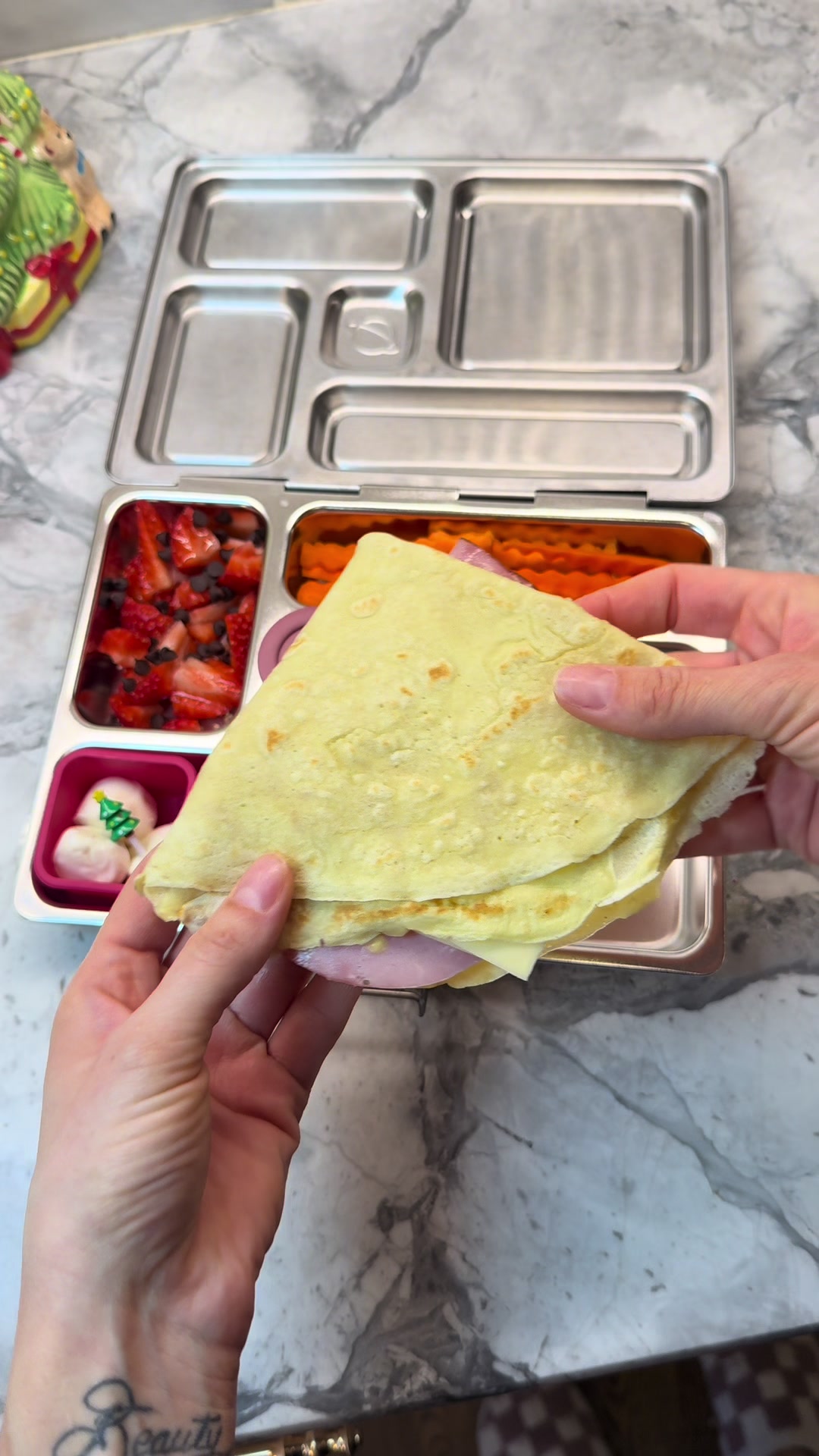 School lunch thin pancake stuffed with ham, plus sweet and savory sides