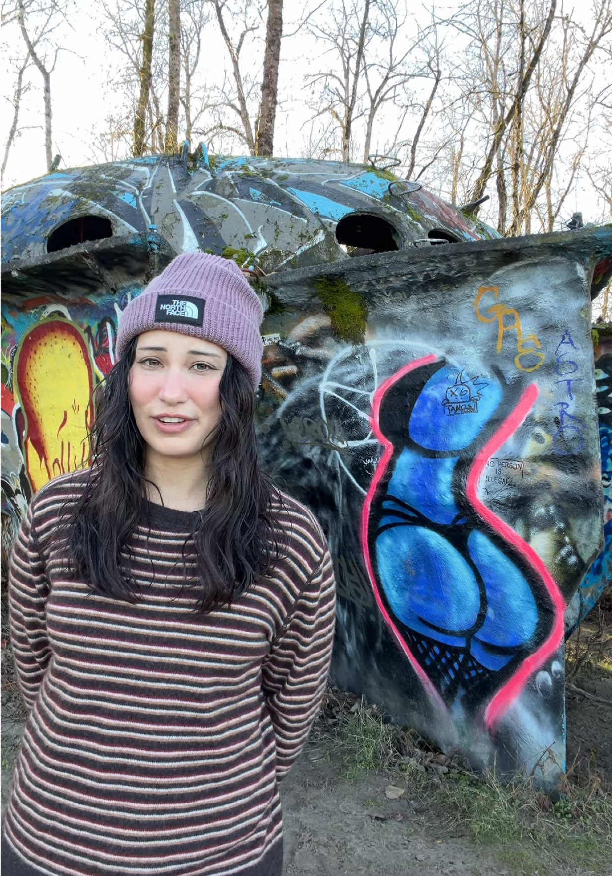 Exploring a UFO-shaped boat covered in graffiti on a Portland beach