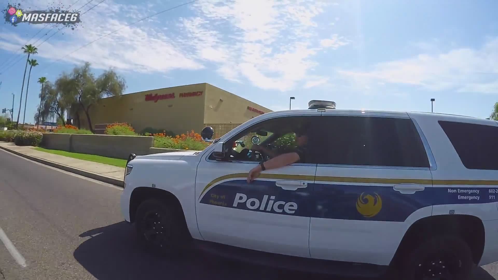 Officer joins riders for photo after brief conversation