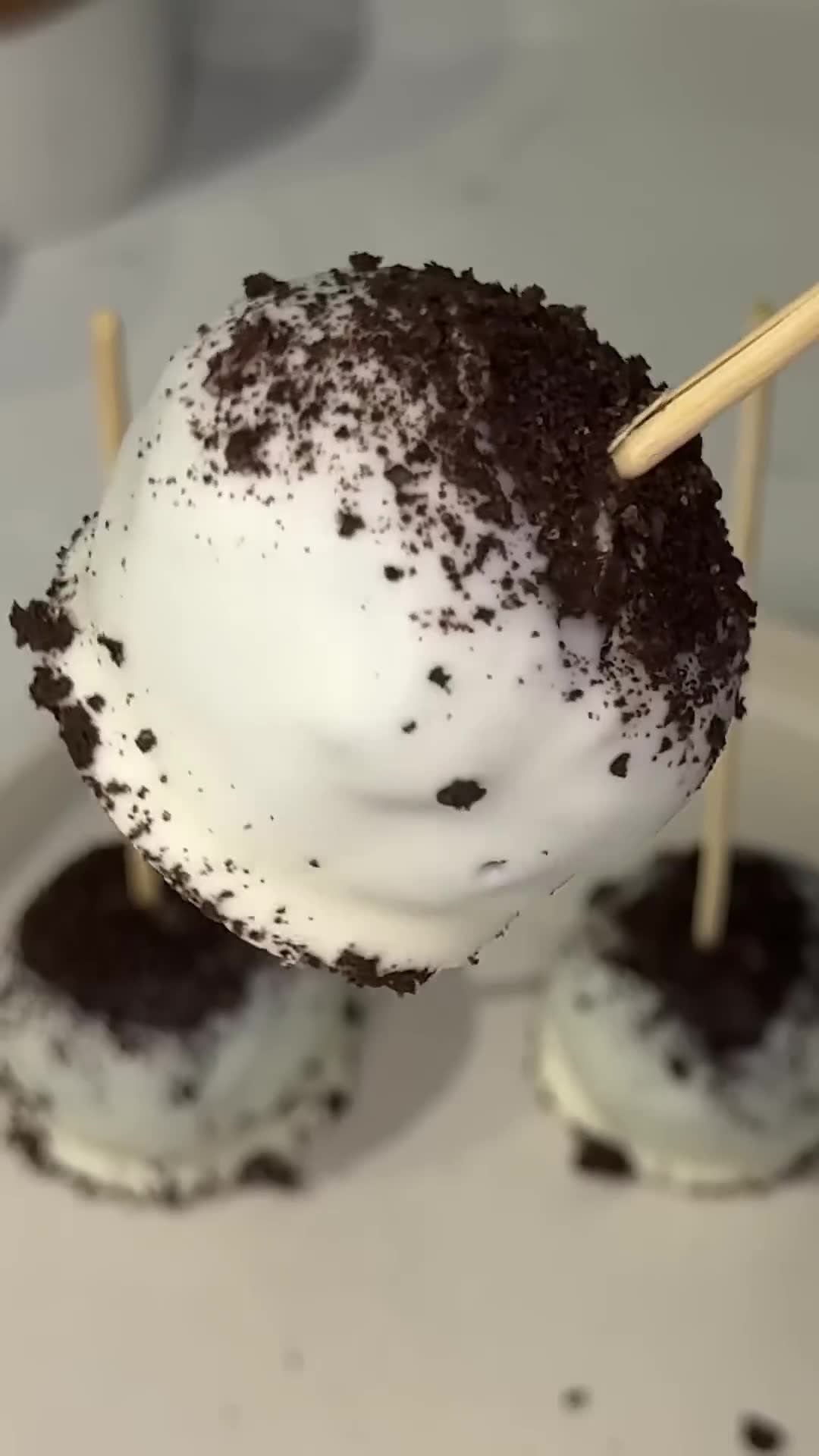 Crushed sandwich cookies formed into truffle pops with coating