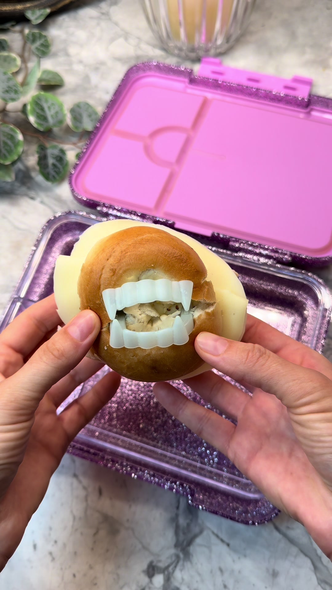 Themed lunchbox featuring vampire-inspired bagel sandwich