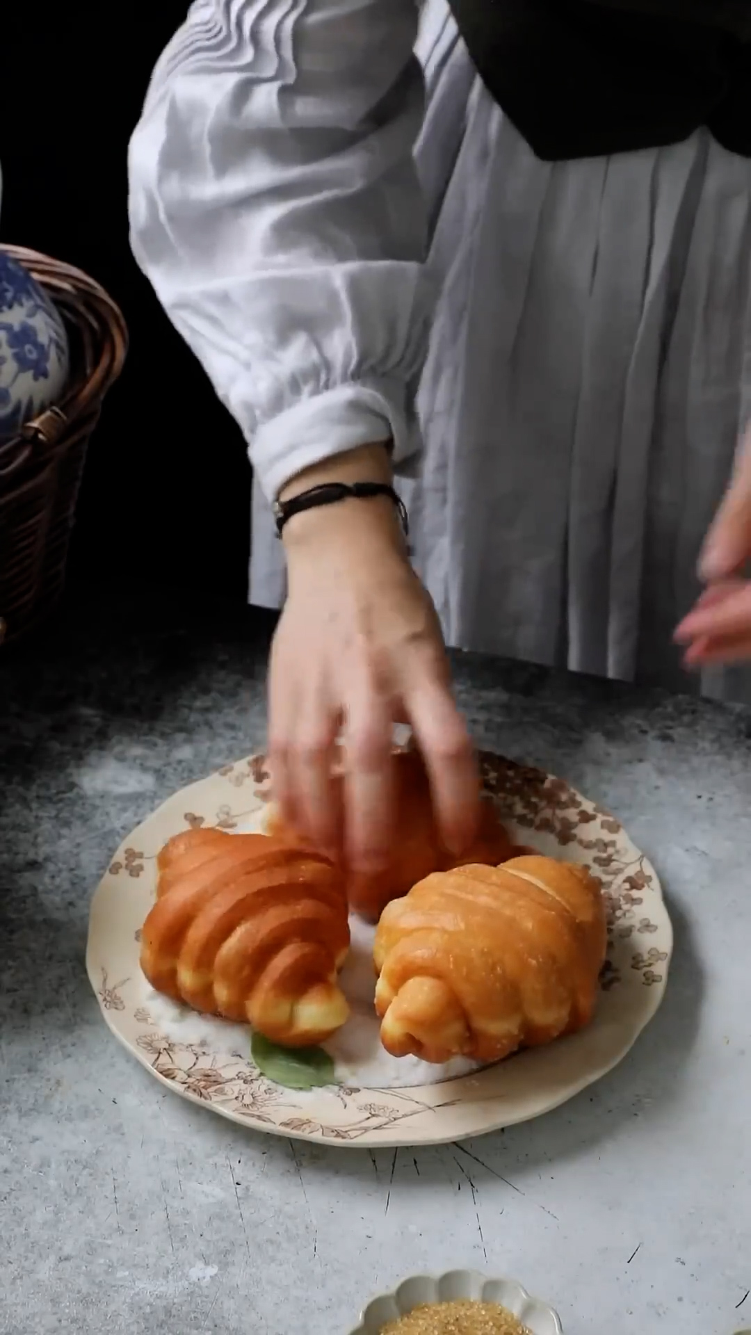 Croissant dough shaped like donuts with blueberry lemon glaze