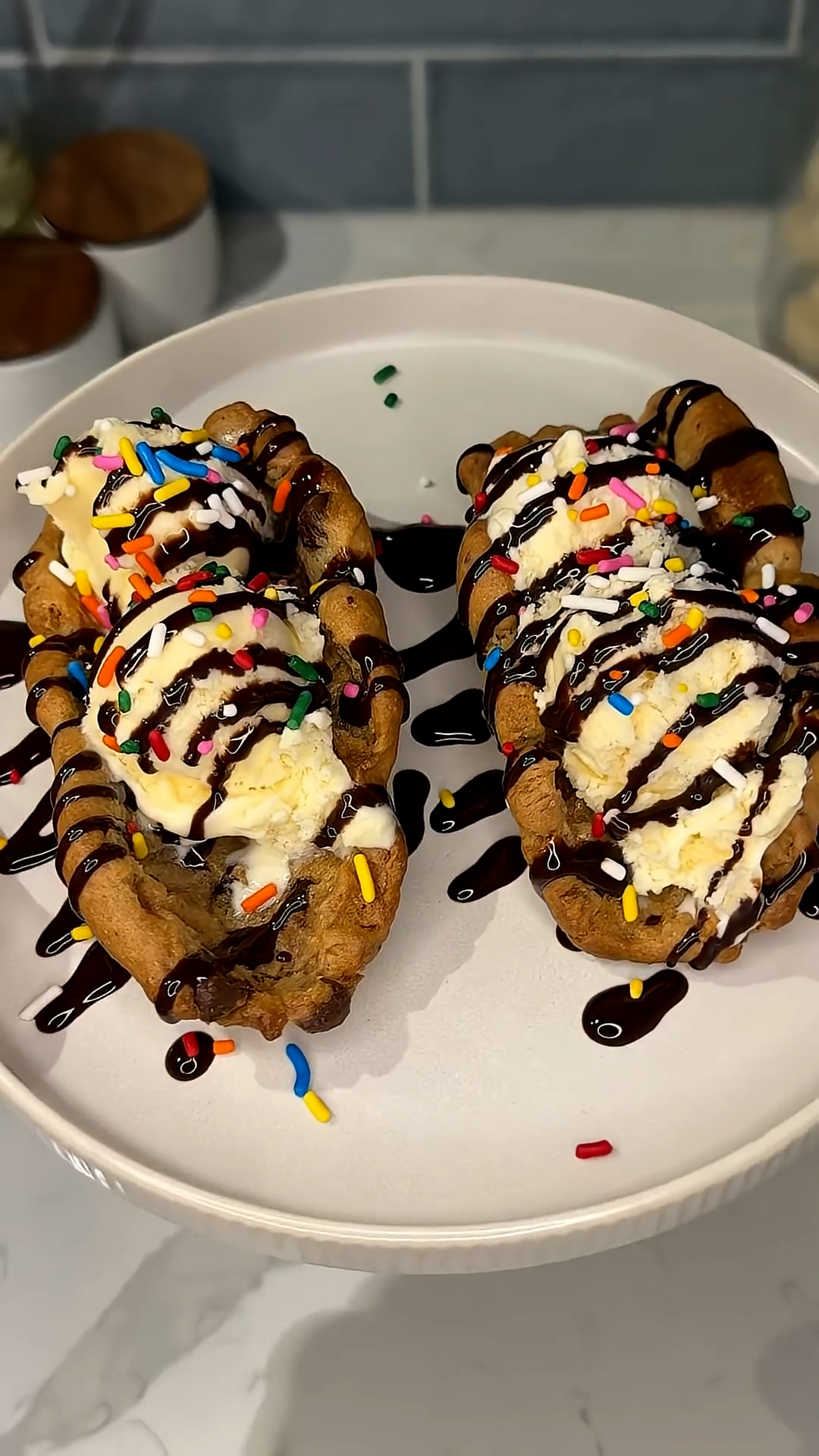 Warm cookies folded taco-style around ice cream scoops
