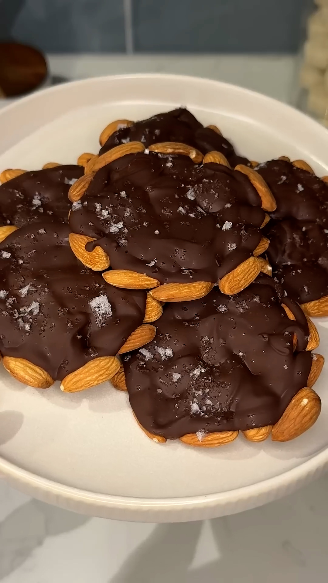Nut slices dipped in chocolate with salt finishing touch