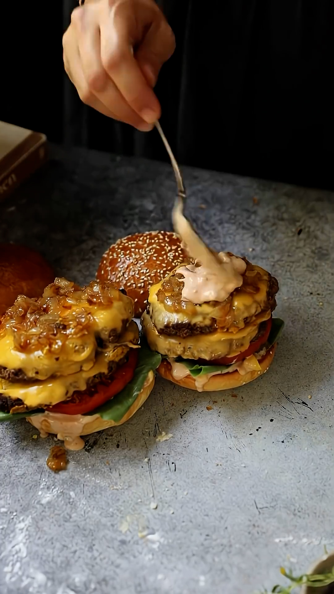 Stacked burgers with two patties and melted cheese