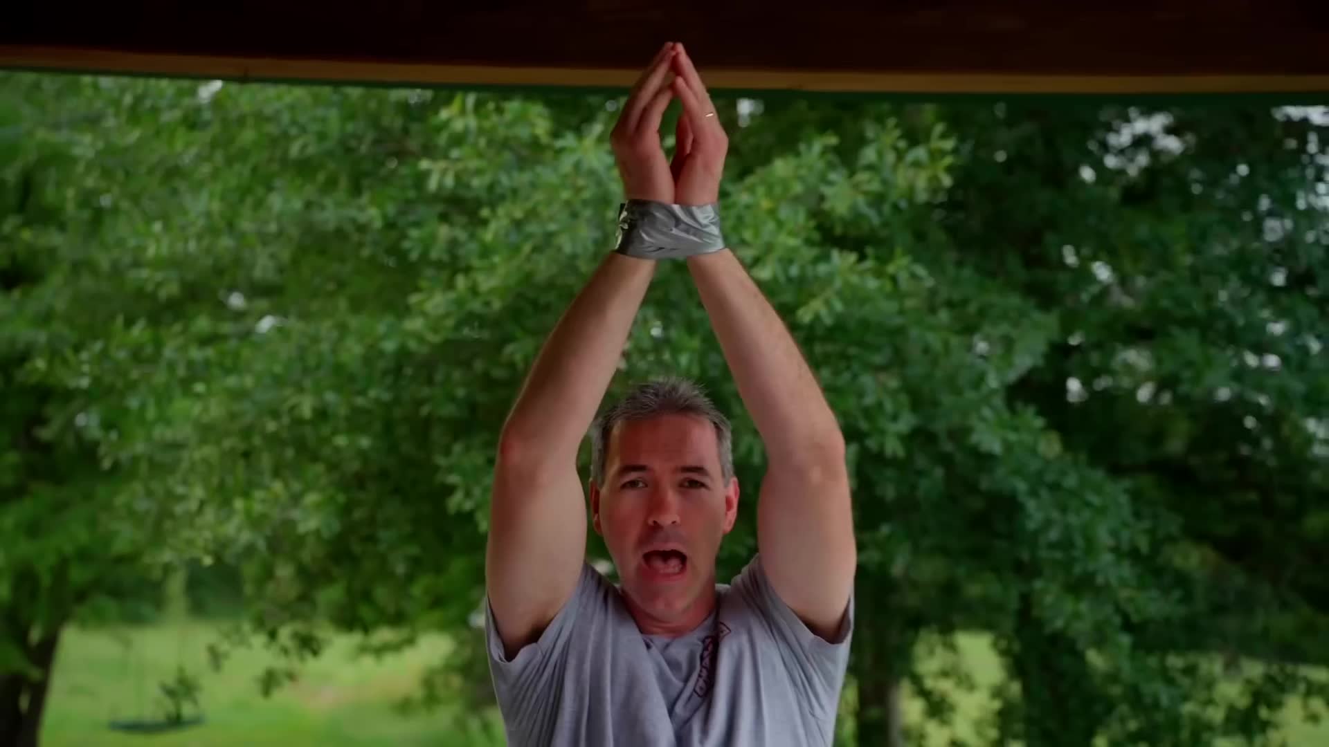 Wrist movement that snaps duct tape bindings in a single motion