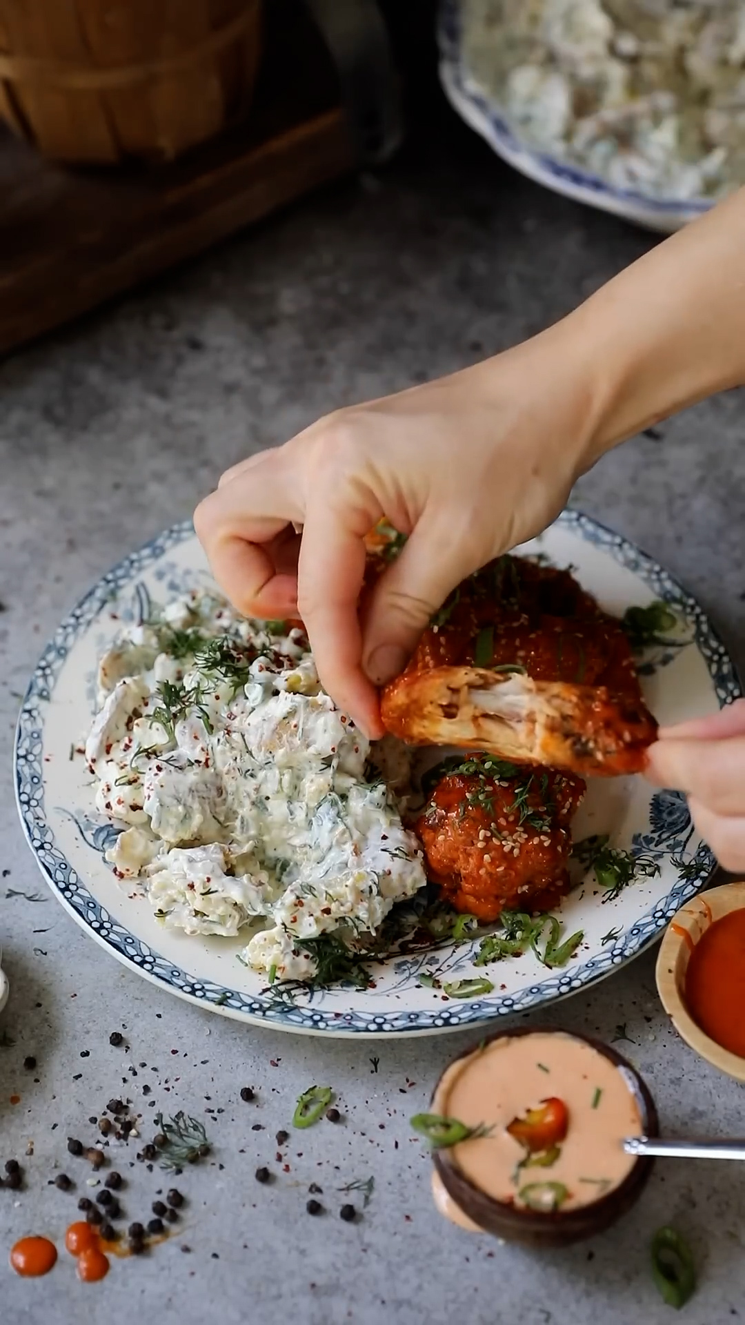 Spicy buffalo chicken served with potato salad