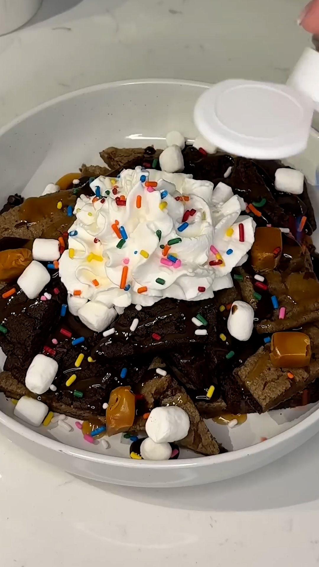 Broken cookies arranged chip-style with melted chocolate drizzle