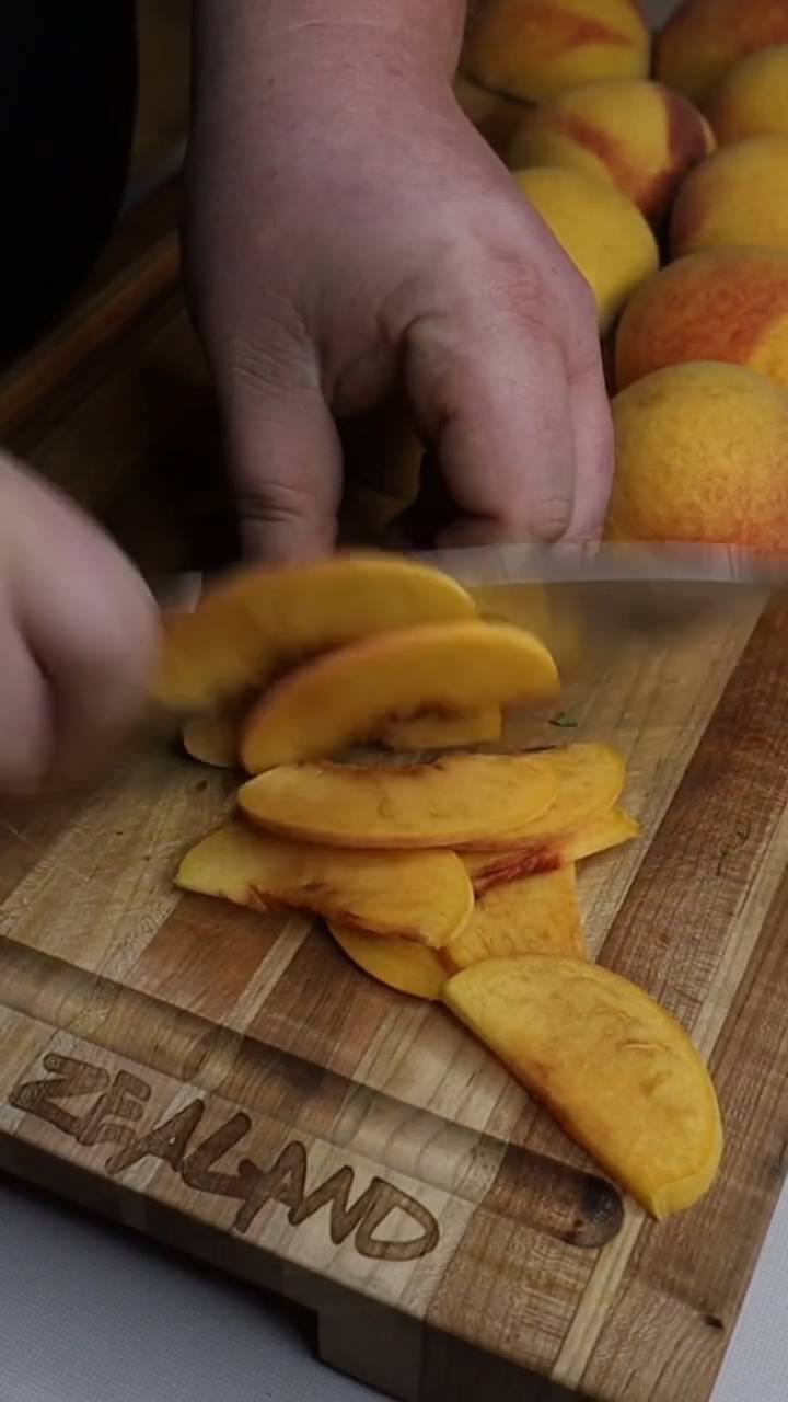 Sweet peach cobbler with buttery biscuit topping and cinnamon
