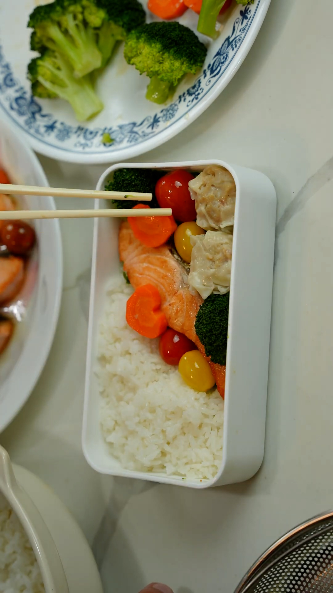 Assembling a balanced salmon bento box with all the essentials