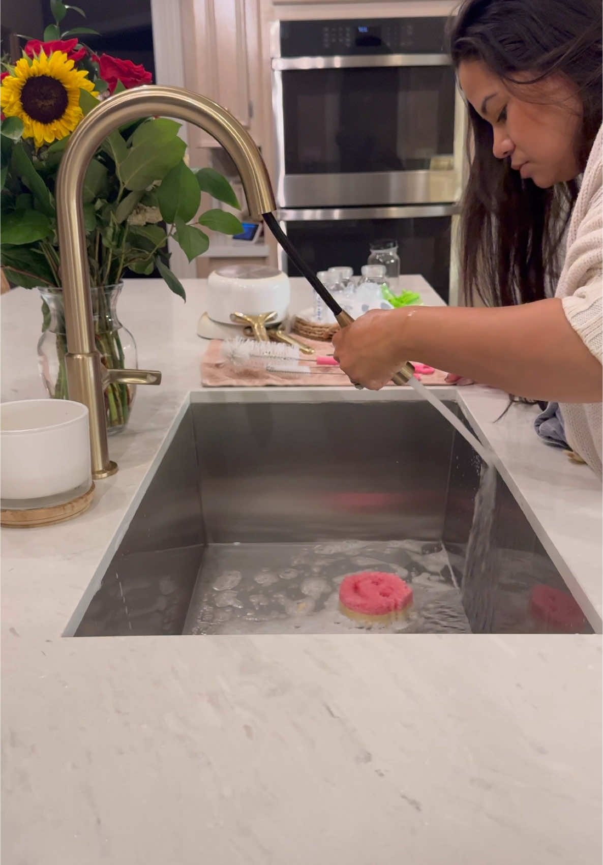 Scrubbing the kitchen sink and easing a fussy Millie through her bath and bedtime