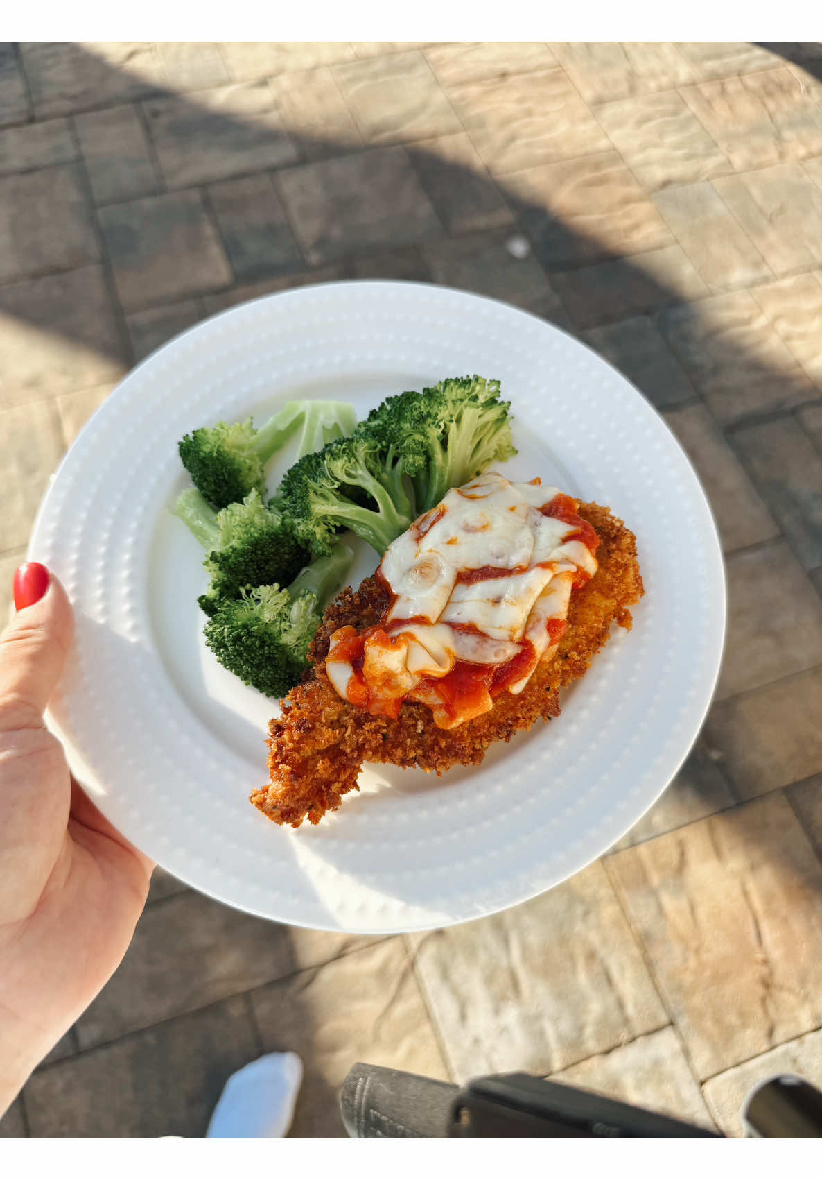 Making crispy chicken parmesan with steamed broccoli and a squeeze of lemon late at night