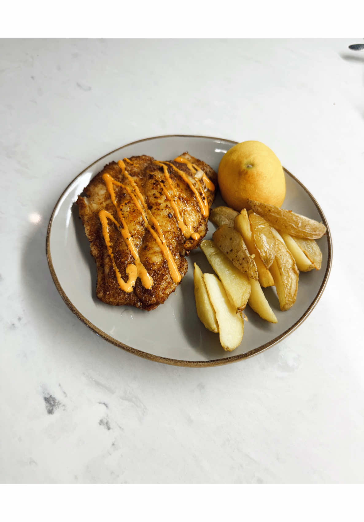 Eating a fish fillet with fries and lemon as I quietly work through my own doubts