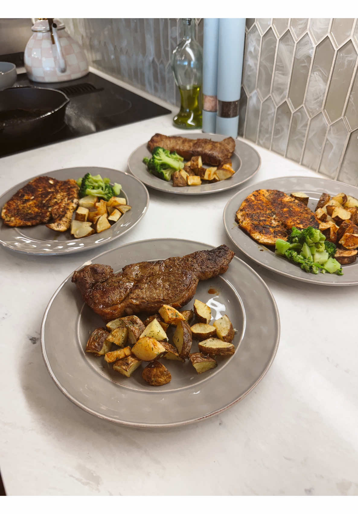 Making a big dinner meal prep with steak, chicken, roasted potatoes, and tender broccoli