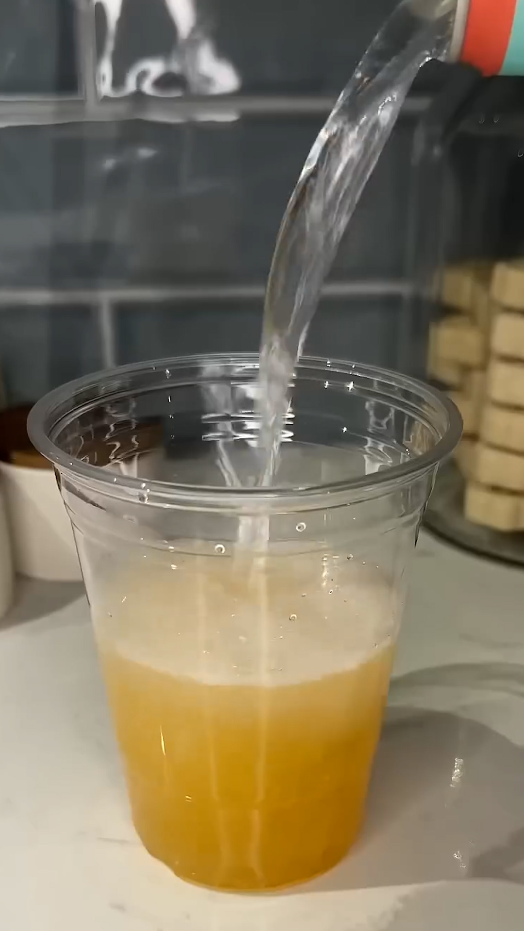 Juice-filled peach pearls burst through a chilled summer beverage