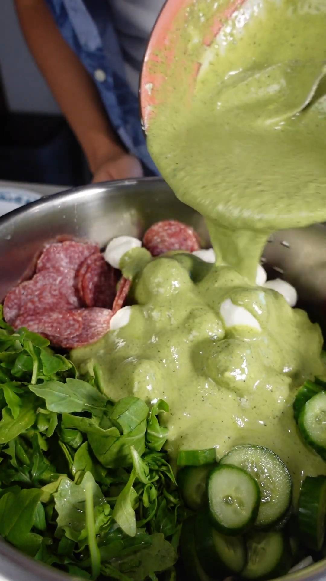 Making vibrant pesto pasta salad perfect for warm weather meals