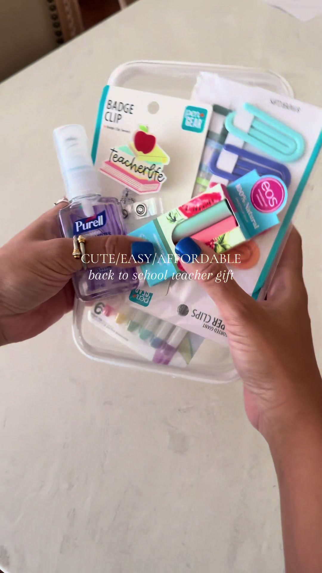 Putting together a cute teacher gift with Purell, eos lip balm, and a little badge clip