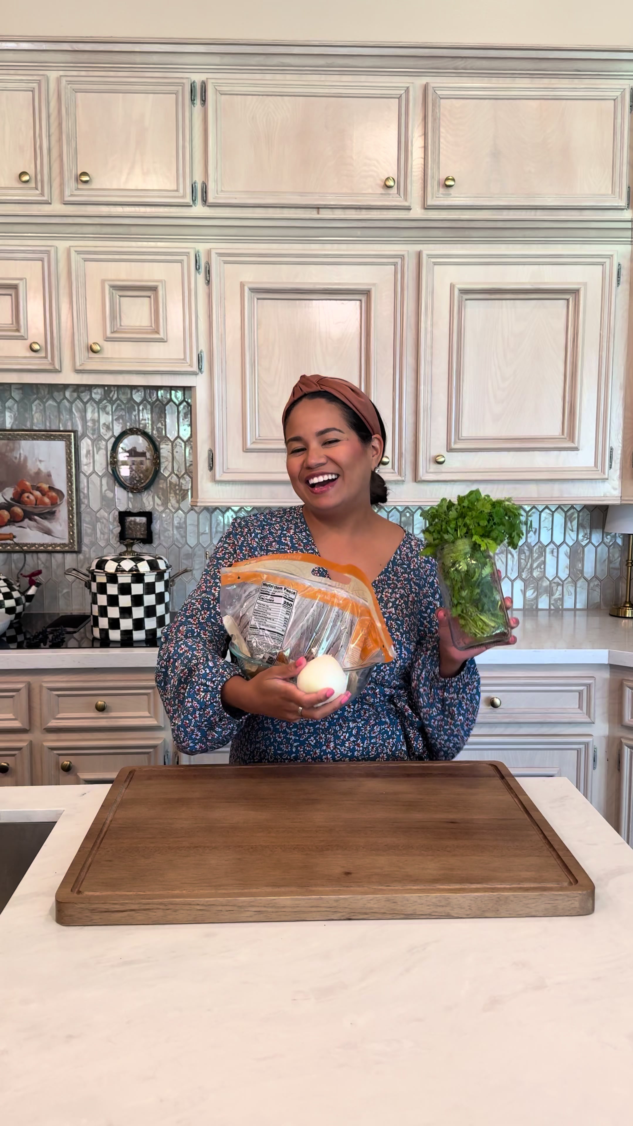 Making an easy family dinner with shredded rotisserie chicken, onion, and fresh herbs