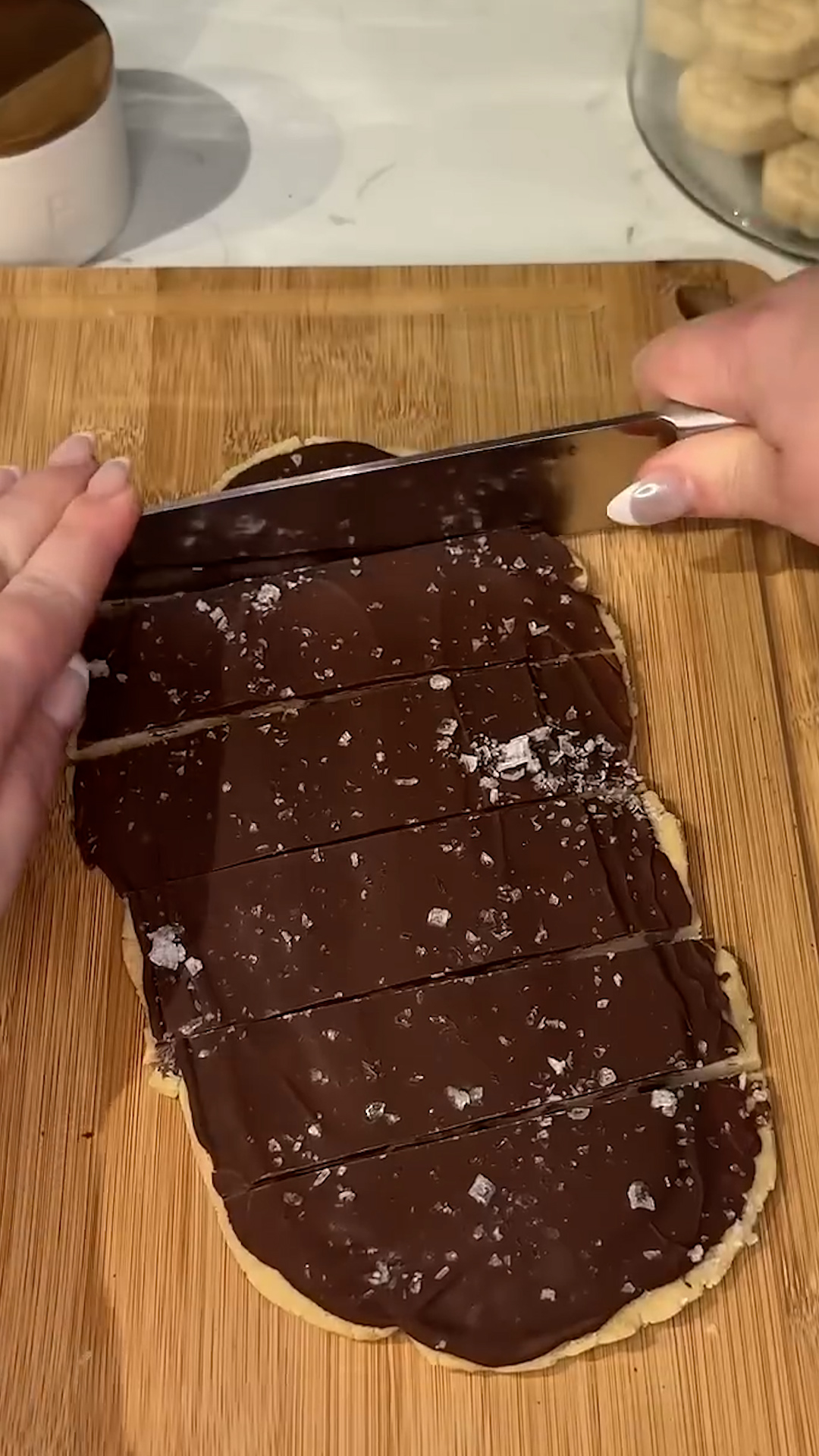Cookie dough pressed thin and frozen into breakable chocolate bark