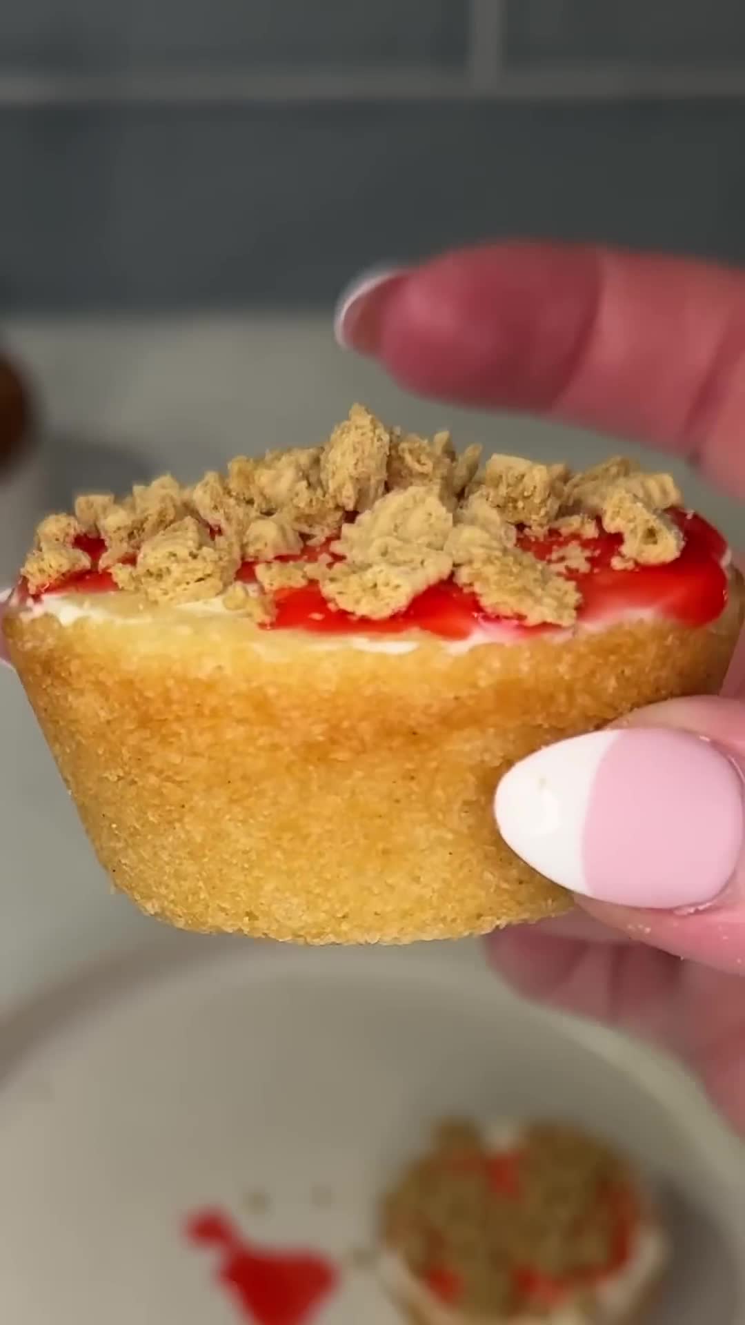 Soft sugar cookie cups hold a creamy mini cheesecake filling